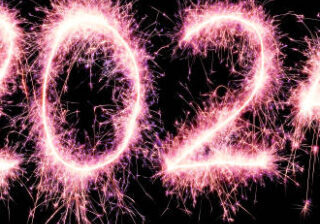 The number 2024 made with a long exposure of sparklers